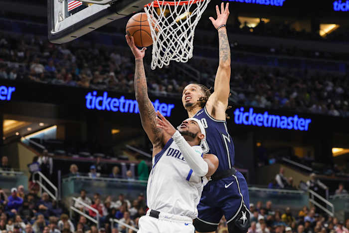 Orlando Magic guard Cole Anthony goes up for a block against Dallas Mavericks guard Jaden Hardy (1)